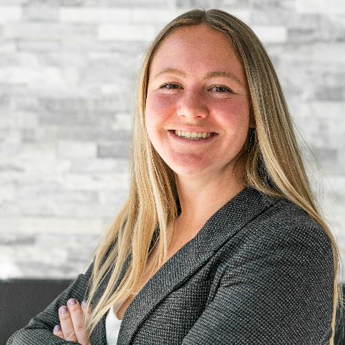 Portrait of Cassidy Cabanzo, Utah REALTOR, smiling with arms crossed
